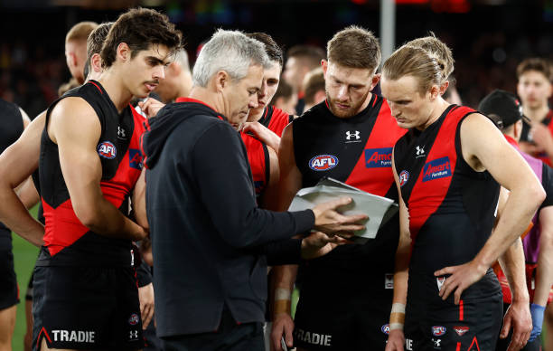 Blake Caracella, Assistant Coach of the Bombers show players vision a tablet